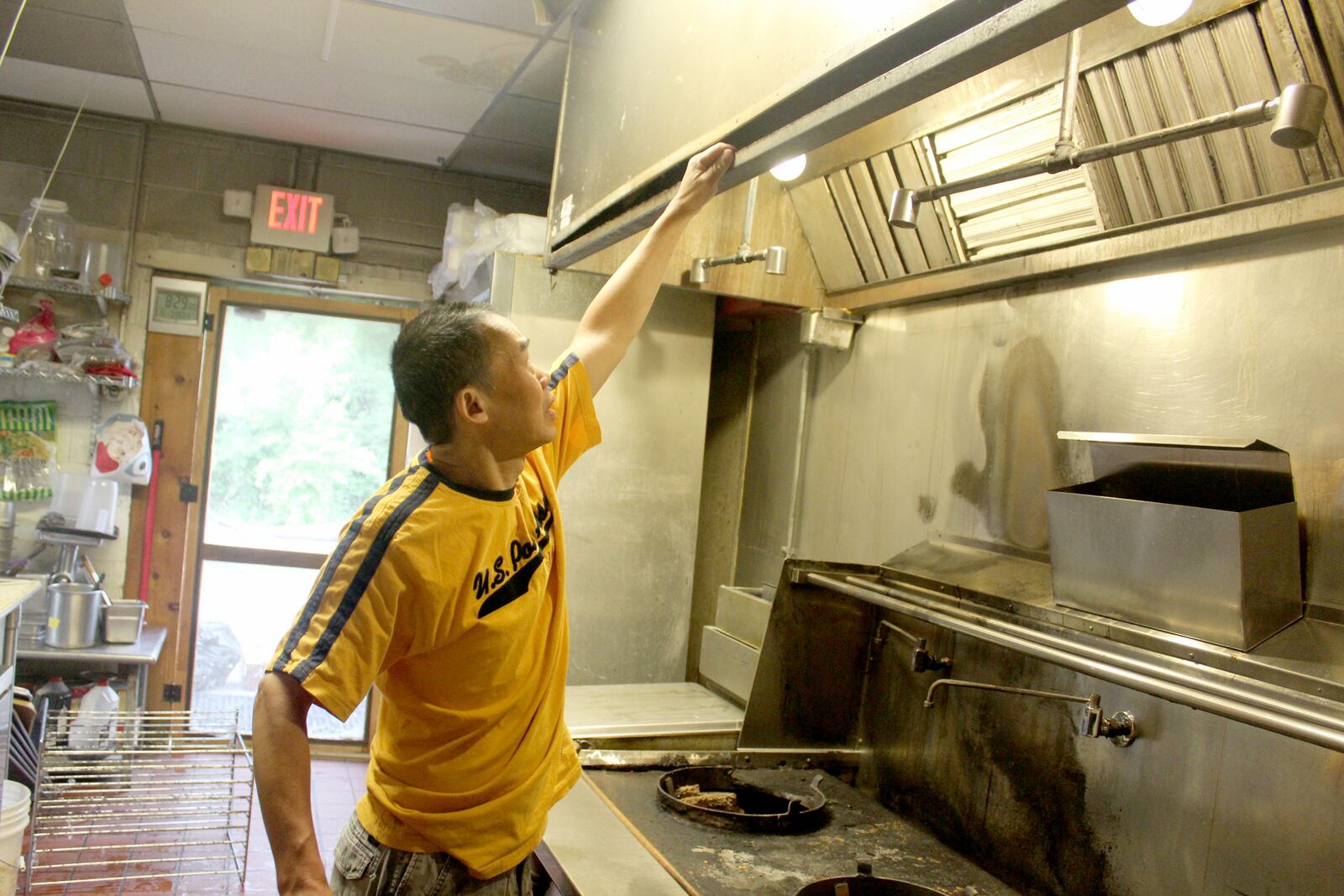 Little Saigon Restaurant,  1718 Woodman Dr. in Kettering, plans to reopen July 25. Bao Thoi, a co-owner,  points to damaged caused by the fire and the fire suppression system.