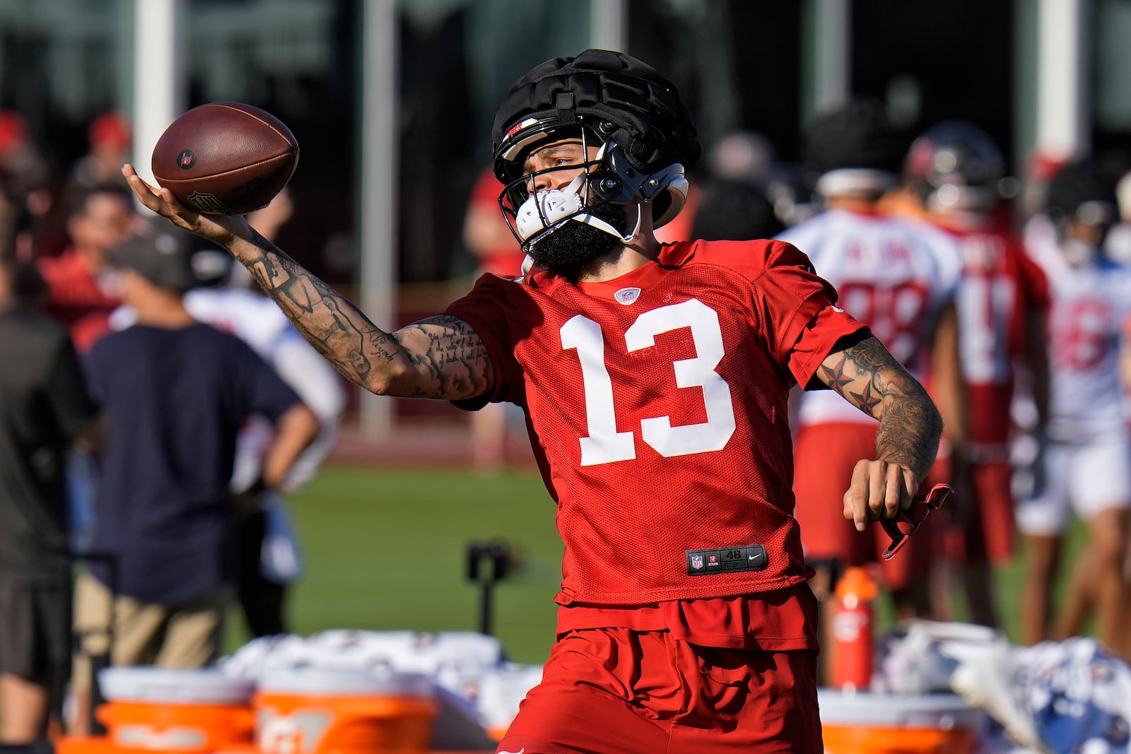Tampa Bay Buccaneers wide receiver Mike Evans (13) makes a one-handed catch during practice at the team’s NFL football training camp, Thursday, July 24, 2025, in Tampa, Fla. (AP Photo/Chris O'Meara)