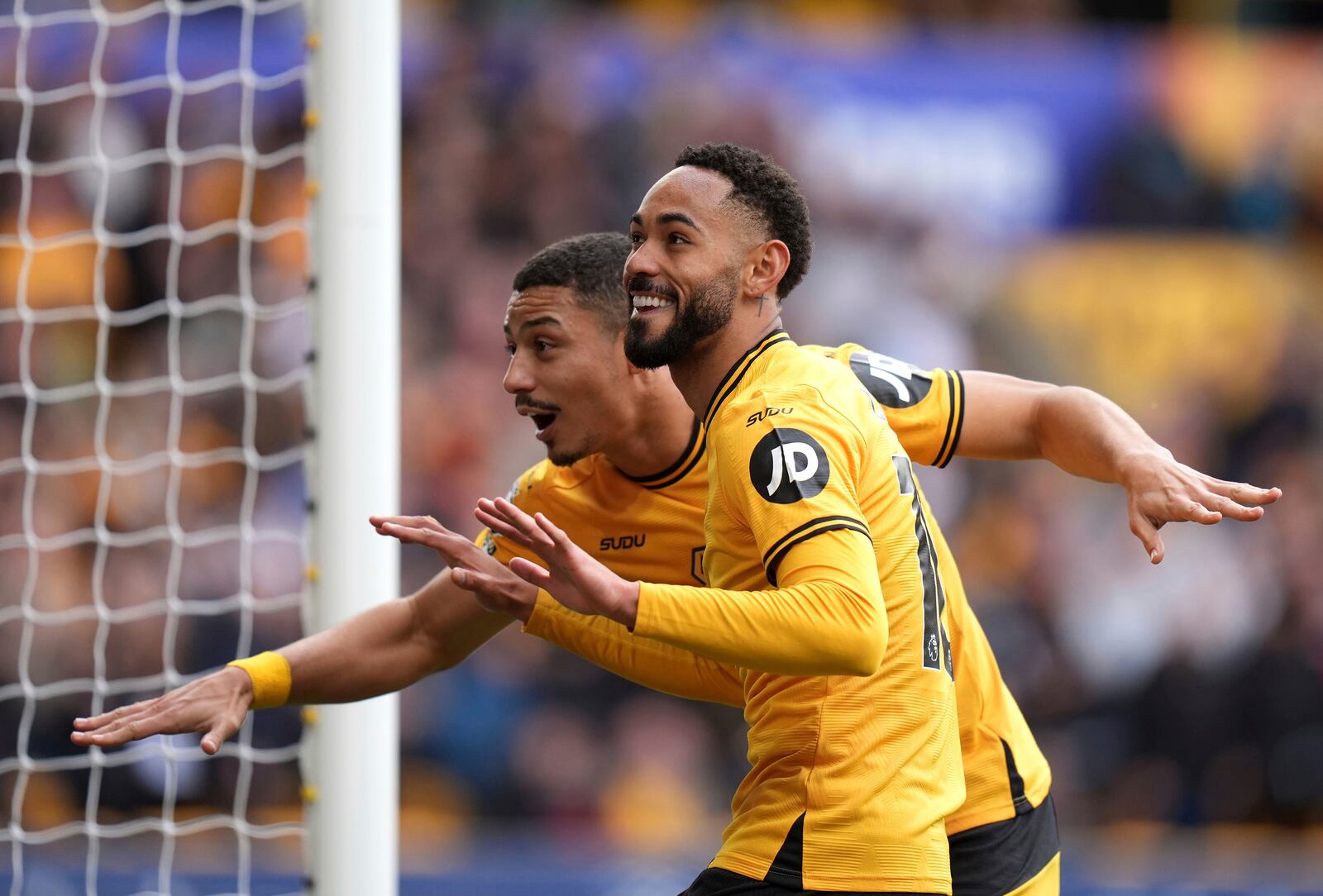 Wolverhampton Wanderers' Matheus Cunha celebrates scoring their side's fourth goal of the game during the English Premier League soccer match between Wolverhampton and Tottenham Hotspur at Molineux Stadium in Wolverhampton, England, Sunday, April 13, 2025. (Jacob King/PA via AP)