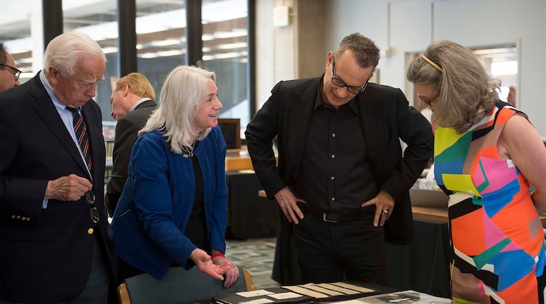 Pulitzer Prize-winning historian David McCullough (from left), Wright State University's Head of Special Collections and Archives Dawne Dewey, Academy Award-winning actor Tom Hanks and Amanda Wright Lane, great- grandniece of the Wright brothers, view some of the Wright brothers artifacts in the Archive's Wright Brothers Collection, one of the most complete collections of Wright material in the world. Photo by Will Jones of Wright State University