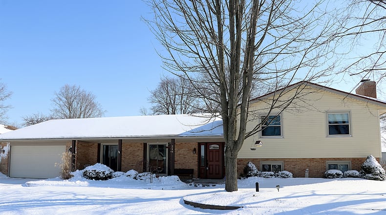 The brick-and-vinyl tri-level has about 2,870 sq. ft. of living space with 3 to 4 bedrooms and a heated Florida room. CONTRIBUTED PHOTO BY KATHY TYLER