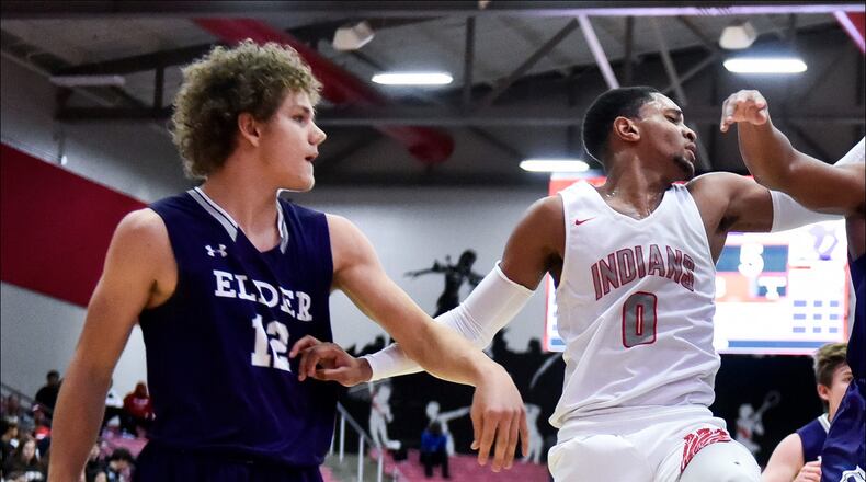 Elder's Joe Royer (12) and Bryson Merz (23) batlle for the ball with Fairfield's Devin Turner (0) and Caleb Pryce (5) during their game Friday, Nov. 30 on opening night of boys basketball at Fairfield High School. Elder won 62-55. NICK GRAHAM/STAFF
