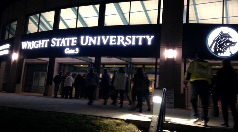 Fans stream into the Nutter Center for Saturday night’s “Country Bands Together” concert to benefit Dayton Children’s Hospital. BRIAN KOLLARS / STAFF