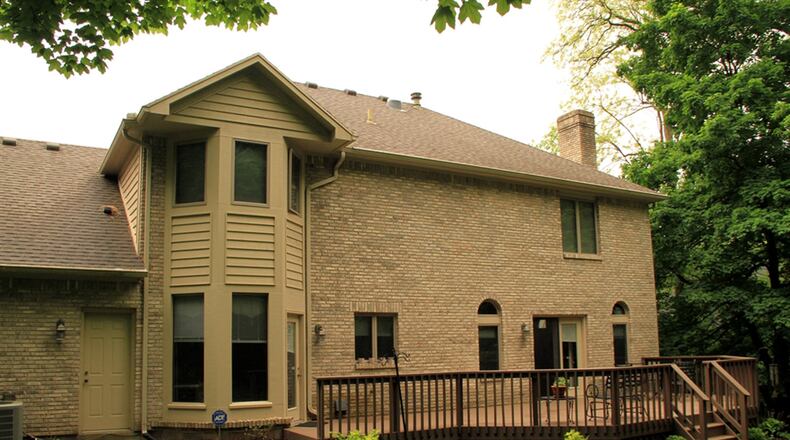 Patio doors off the family room and a door off the breakfast room open out to the rear deck and semi-private, tree-lined back yard. Finished space above the garage is off the main bedroom and is currently set up as a study or office.