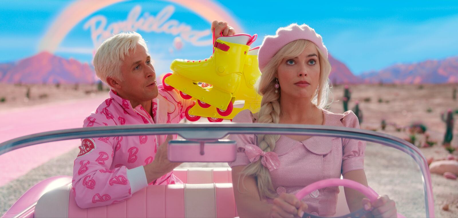 This image released by Warner Bros. Pictures showsRyan Gosling, left, and Margot Robbie in a scene from "Barbie." (Warner Bros. Pictures via AP)