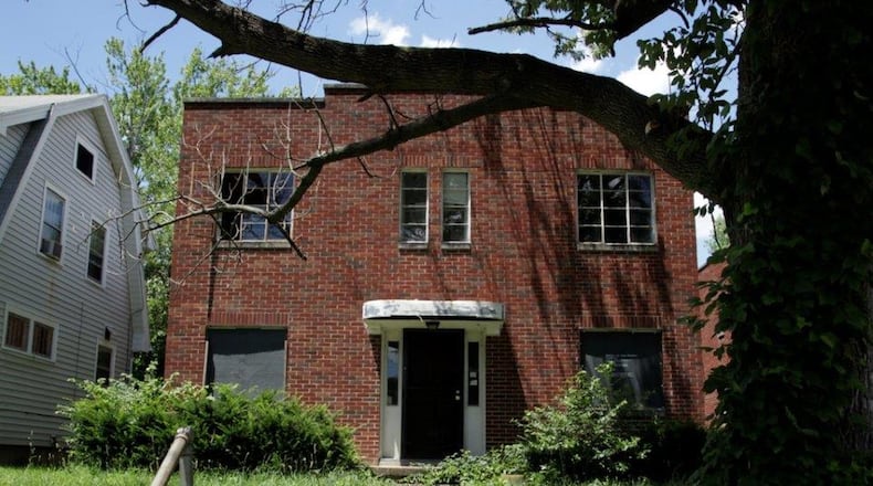 This house on 111 E. Norman Ave. in Dayton is now for sale and eligible for the Lot Links program. BYRON STIRSMAN/STAFF