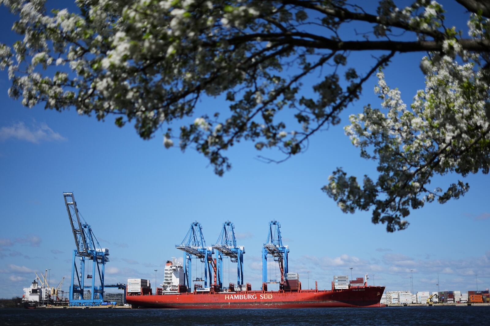 Cranes move containers aboard the ship Polar Mexico at the Port of Philadelphia, Tuesday, April 8, 2025. (AP Photo/Matt Rourke)