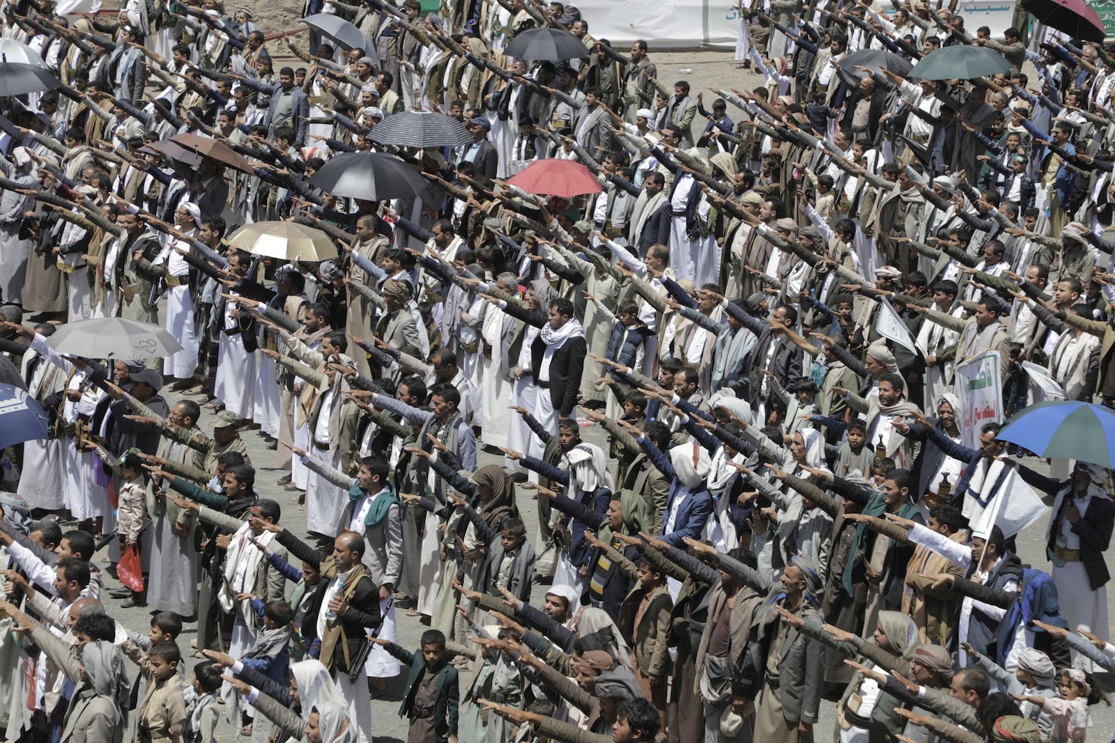 Yemeni Houthis chant religious slogans as they celebrate Eid al-Ghadir, the day on which they believe Islam was completed as a religion by the appointment of Ali as Prophet Muhammad's successor, at Al Imam Ali park in Sanaa, Yemen, Saturday, June 14, 2025. (AP Photo/Osamah Abdulrahman)