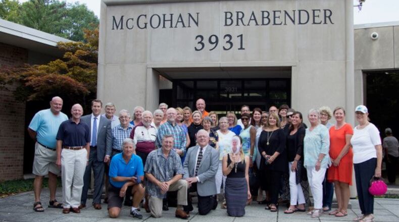 Some members of the 100+ Women Who Care and the 100+ Men Who Care groups .