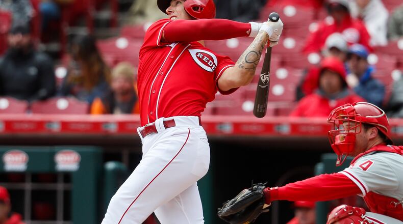 Cincinnati Reds’ Michael Lorenzen hits a solo home run off Philadelphia Phillies starting pitcher Adam Morgan in the sixth inning of a baseball game, Thursday, April 6, 2017, in Cincinnati. (AP Photo/John Minchillo)