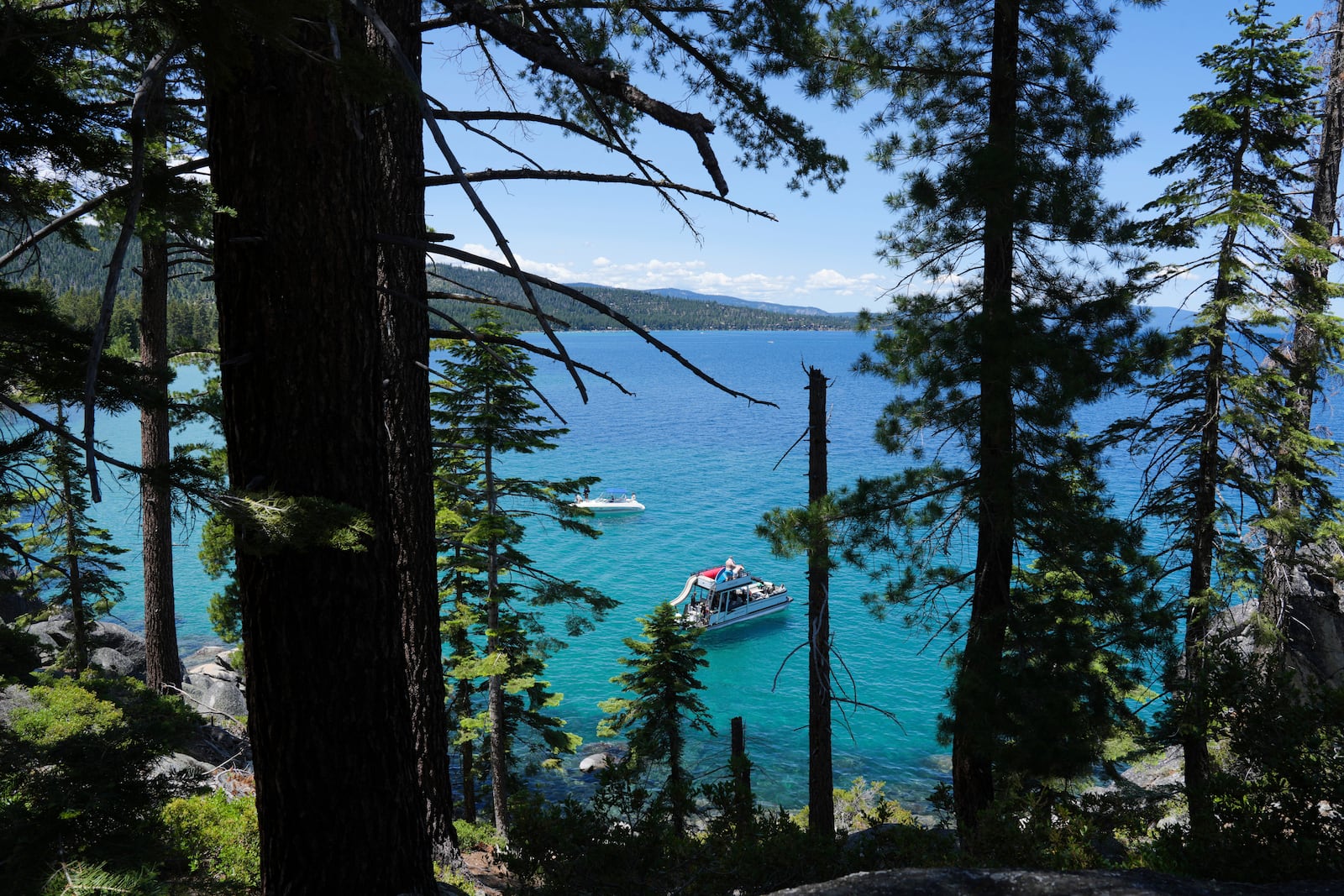 A boat carries visitors at D.L. Bliss State Park after a weekend incident in which a boat capsized, killing several people, on Monday, June 23, 2025, in Lake Tahoe, Calif. (AP Photo/Brooke Hess-Homeier)