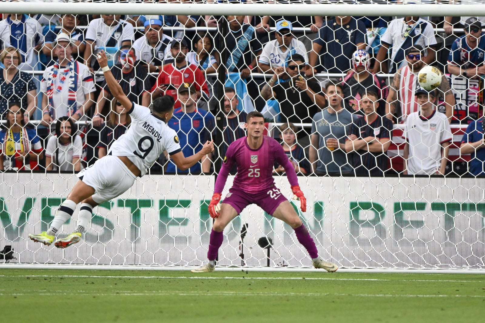 Guatemala forward Rubio Mendez (9) is unable to score past United States goalkeeper Matthew Freese (25) during the first half of a CONCACAF Gold Cup semifinal soccer match, Wednesday, July 2, 2025, in St. Louis. (AP Photo/Connor Hamilton)
