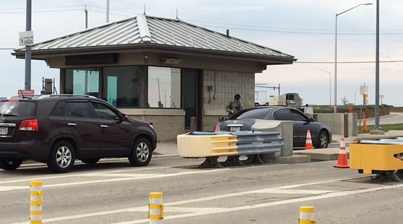 A sentry checks a driver identification at Gate 19B off National Road. The heavily traveled Wright-Patterson gate will be closed for several weeks beginning April 3. BARRIE BARBER/STAFF