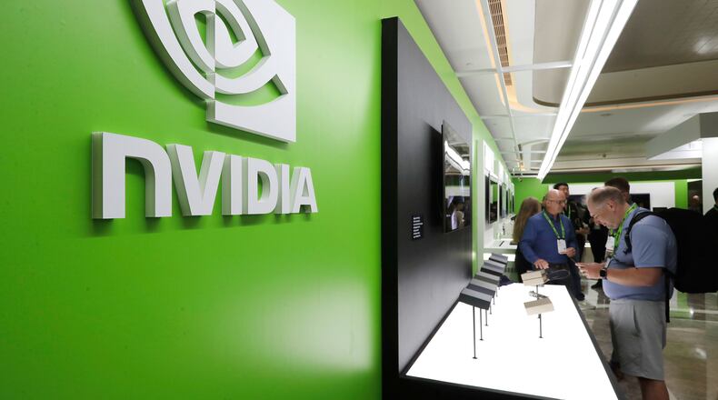 FILE - People take a look to Nvidia''s new products during the Computex 2025 exhibition in Taipei, Taiwan, Wednesday, May 21, 2025. (AP Photo/Chiang Ying-ying, File)
