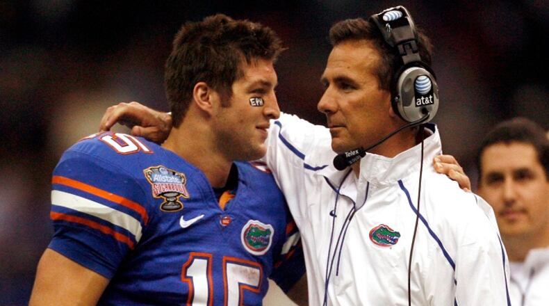 Florida coach Urban Meyer and quarterback Tim Tebow share a moment on the sidelines during the fourth quarter against Cincinnati in the Sugar Bowl on Jan. 1, 2010 in New Orleans. (Gary W. Green/Orlando Sentinel/TNS)