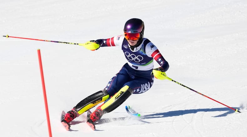 United States' Mikaela Shiffrin arrives at the finish area of an alpine ski, women's slalom race, at the 2026 Winter Olympics, in Cortina d'Ampezzo, Italy, Wednesday, Feb. 18, 2026. (AP Photo/Andy Wong)