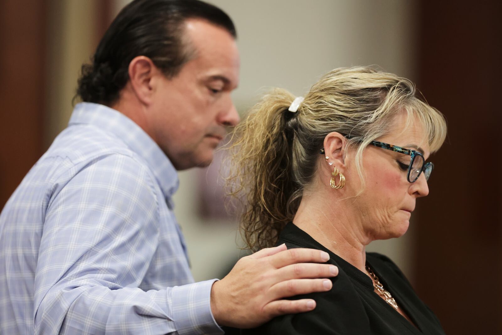 Steve Goncalves consoles Kristi Goncalves, mother of victim Kaylee Goncalves speaks at the sentencing hearing of Bryan Kohberger at the Ada County Courthouse, Wednesday, July 23, 2025, in Boise, Idaho, for brutally stabbing four University of Idaho students to death nearly three years ago. (AP Photo/Kyle Green, Pool)