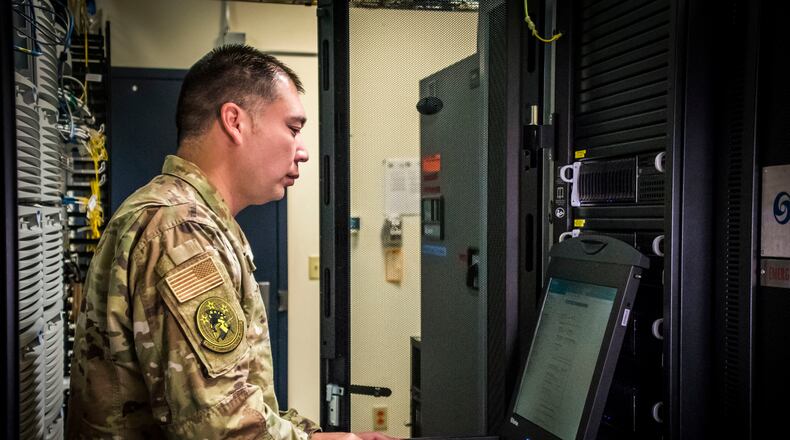 Senior Master Sgt. Nick Wirwille, Superintendent of the Cyber Systems Operations shop with the 179th Airlift Wing Communications Squadron, works on a computer Oct. 6, 2019, at the 179th Airlift Wing, Mansfield, Ohio. Cyber Systems Operations specialists design, install and support systems to ensure they operate properly and remain secure from outside intrusion. (U.S. Air National Guard photo by Airman 1st Class Alexis Wade)