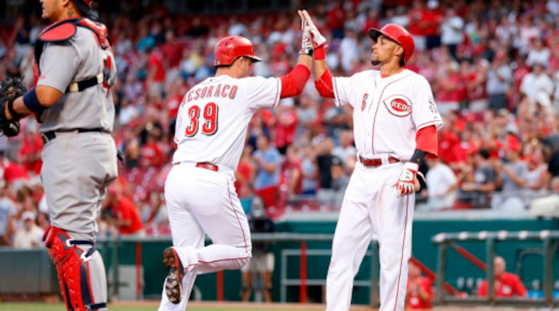 CINCINNATI, OH - SEPTEMBER 9: Devin Mesoraco #39 of the Cincinnati Reds is congratulated by Billy Hamilton #6 after hitting a two-run home run in the first inning of the game against the St. Louis Cardinals at Great American Ball Park on September 9, 2014 in Cincinnati, Ohio. (Photo by Joe Robbins/Getty Images)