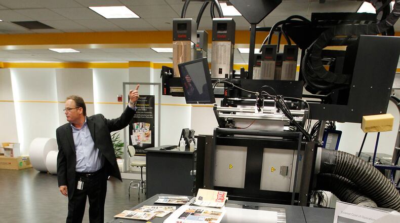 A Kodak vice president of digital printing talks about Kodak Prosper printers at the company’s Kettering plant in this 2013 photo. TY GREENLEES / STAFF
