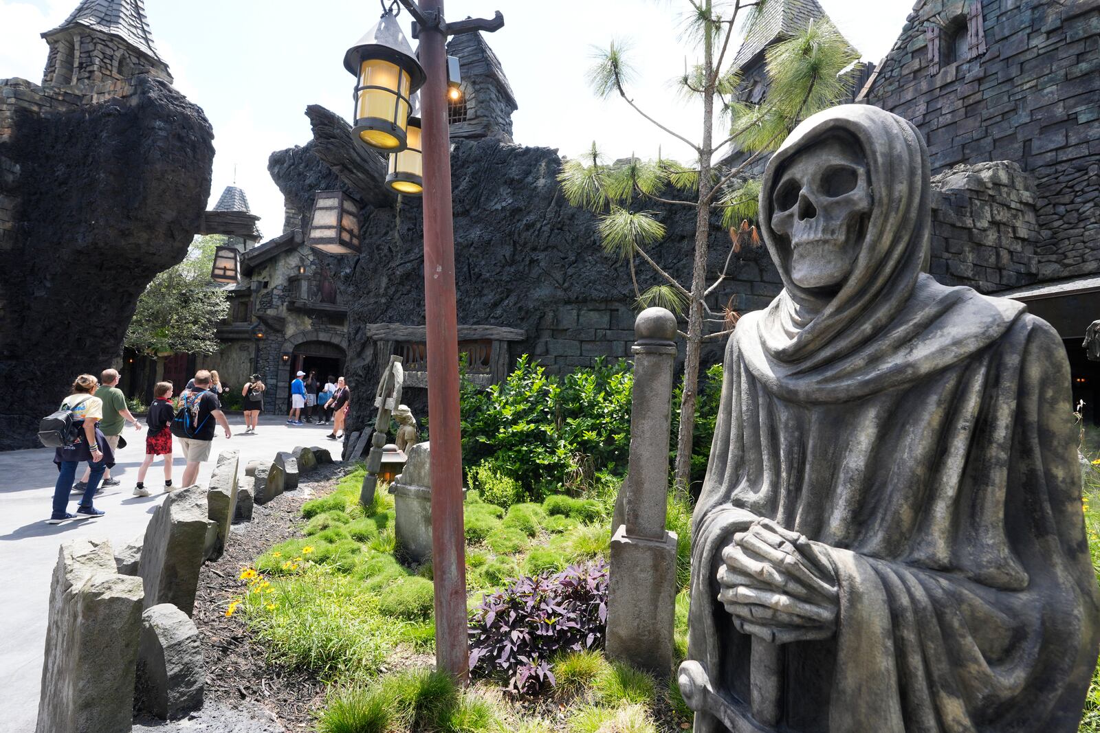 Guests tour the Dark Universe at Epic Universe Theme Park at Universal Resort Orlando Thursday, April 10, 2025, in Orlando, Fla. (AP Photo/John Raoux)
