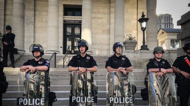Dayton police at Courthouse Square, just before the 7 p.m. on May 31, 2020. JIM NOELKER / STAFF