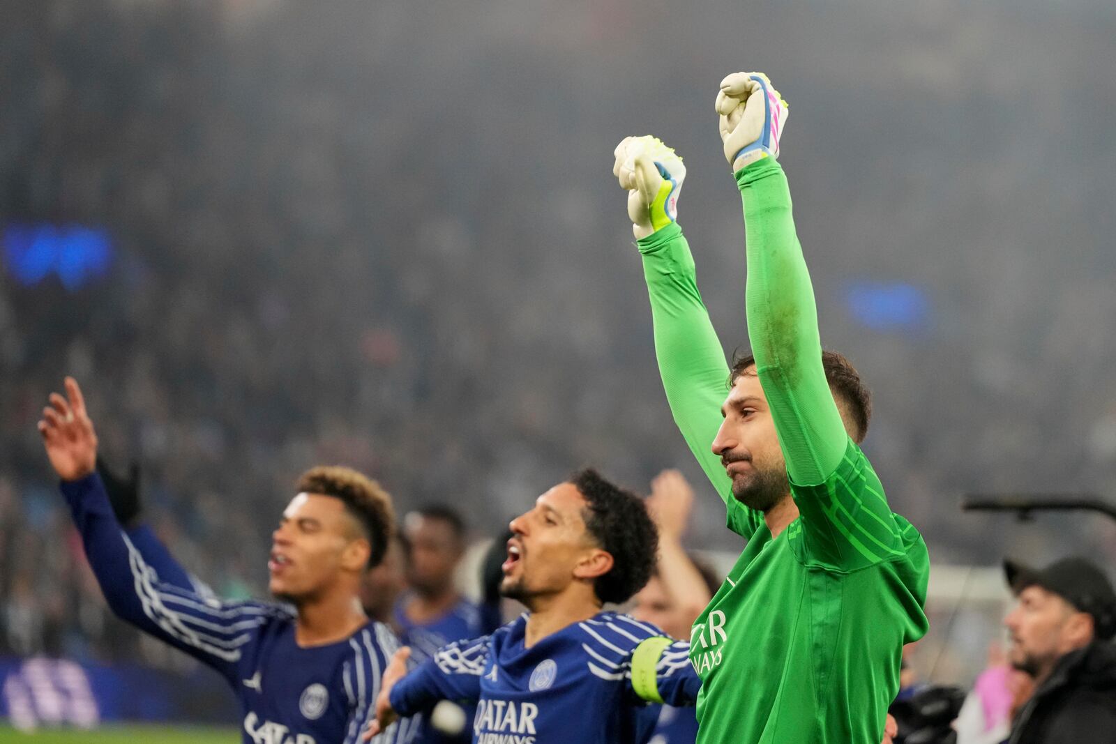PSG's goalkeeper Gianluigi Donnarumma and team mates applaud fans at the end of the Champions League quarterfinal second leg soccer match between Aston Villa and Paris Saint-Germain at the Villa Park stadium, in Birmingham, England, Tuesday, April 15, 2025. (AP Photo/Frank Augstein)
