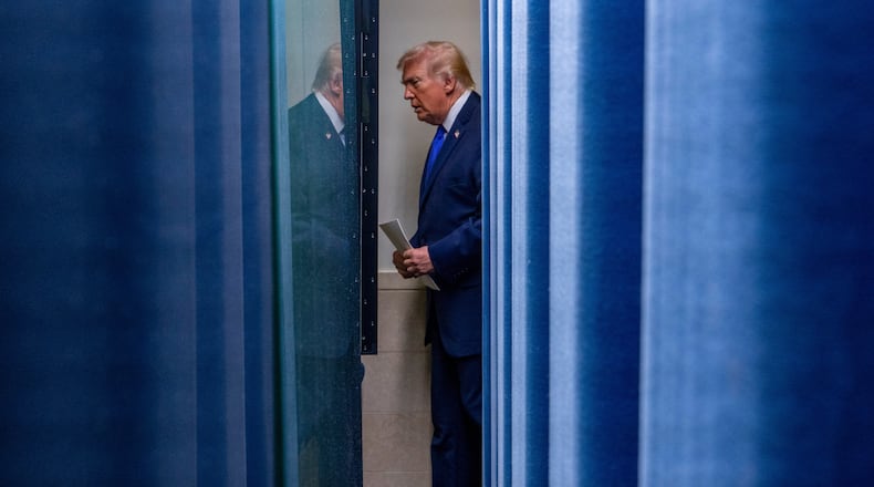 President Donald Trump arrives to speak with reporters in the James Brady Press Briefing Room at the White House, Friday, Feb. 20, 2026, in Washington. (AP Photo/Alex Brandon)