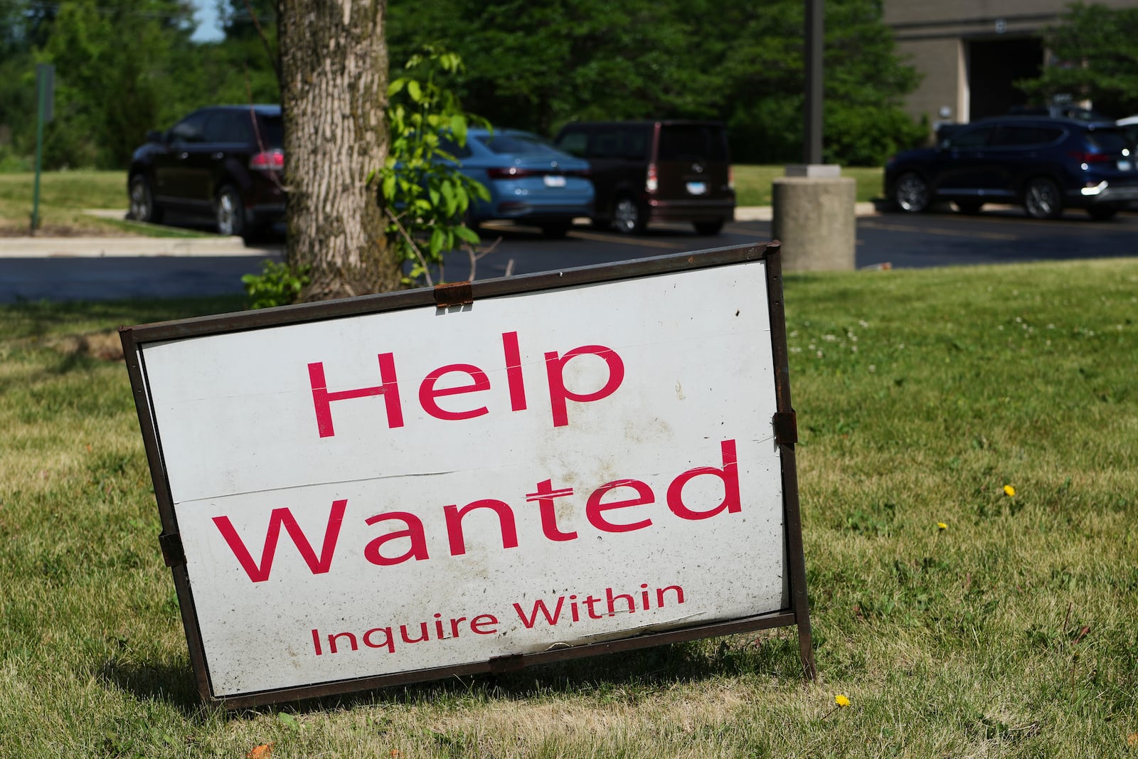 A "Help Wanted" sign is displayed at Illinois Air Team Test Station Saturday, June 21, 2025, in Lincolnshire, Ill. (AP Photo/Nam Y. Huh)