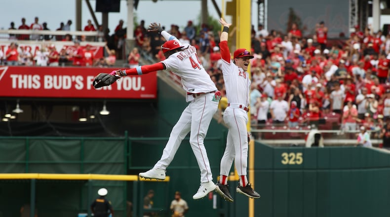 Elly De La Cruz, left, and TJ Friedl, of the Reds celebrate a victory against the Padres on Sunday, July 2, 2023, at Great American Ball Park in Cincinnati. David Jablonski/Staff