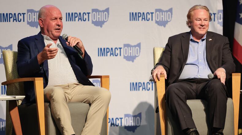 Rep. Dave Taylor (R-Amelia) speaks while U.S. Rep. Warren Davidson (R-Troy) listens during the Ohio Chamber's 2025 Dayton Regional Impact Ohio Conference on Tuesday, Aug. 26, in the Apollo Room in the Student Union at Wright State University. BRYANT BILLING / STAFF