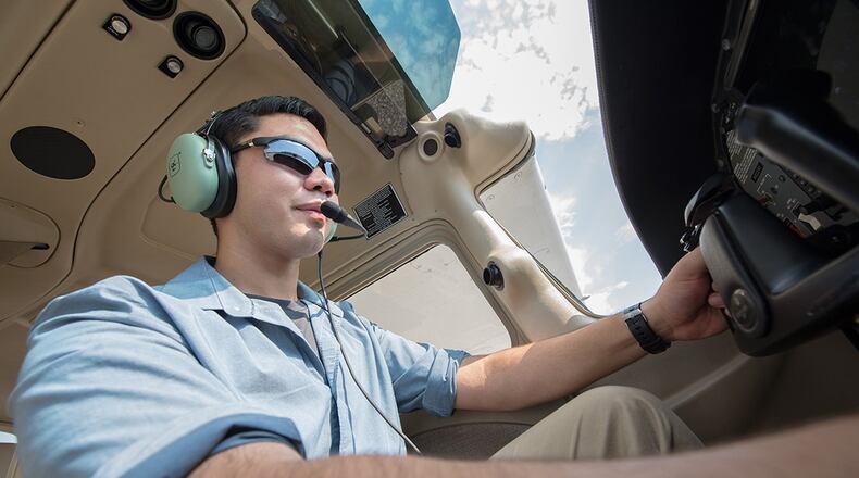 Cadet James Huang, North Gwinnett High School, Suwanee, Georgia, sits in the cockpit of a trainer aircraft at Auburn University, Alabama. Huang is one of 120 cadets selected for a Flight Academy scholarship by Air Force Junior ROTC. The Chief of Staff of the Air Force Flight Academy Scholarship Program allows selected Air Force Junior ROTC cadets to attend an accredited aviation program at one of six partnering universities to get a private pilot license. (U.S. Air Force photo/Airman Matthew Markivee)
