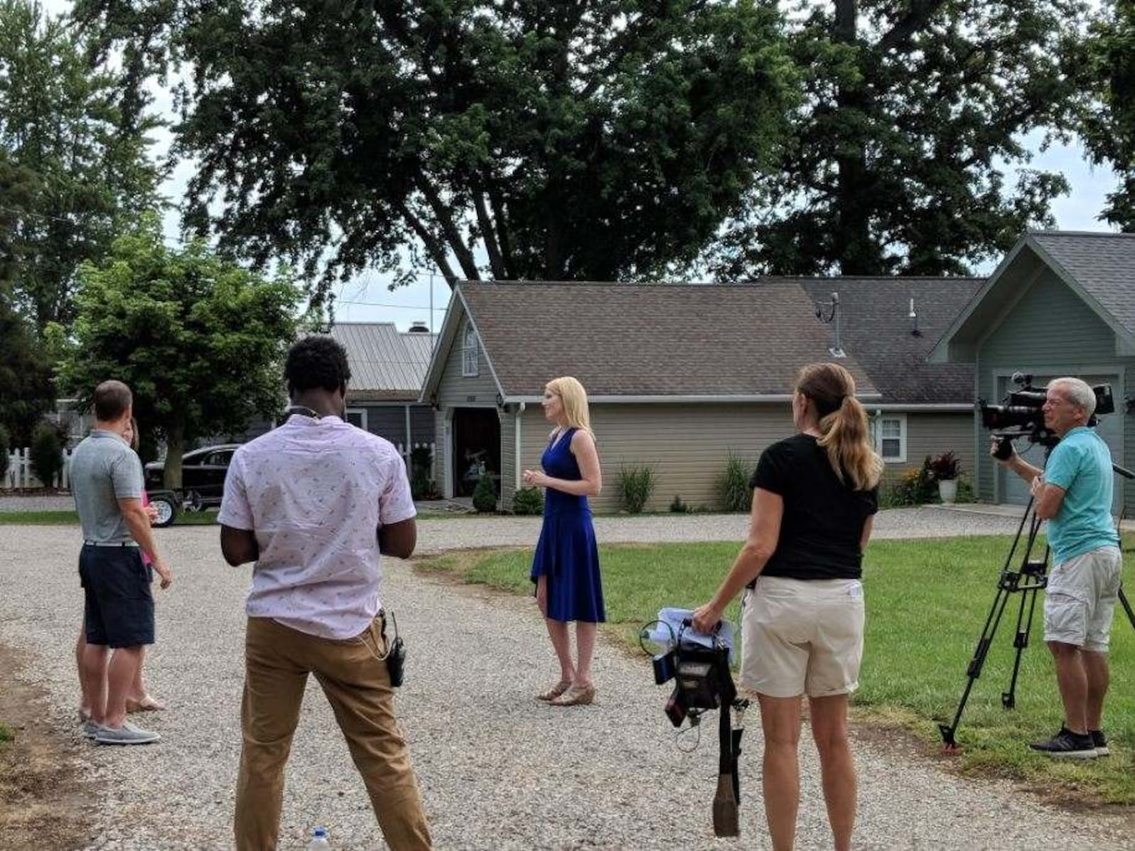 Indian Lake realtor Paige Duff (blue dress) is pictured with Dayton area residents Chris and Tina Gibbs and members the crew of HGTV's "Island Life."