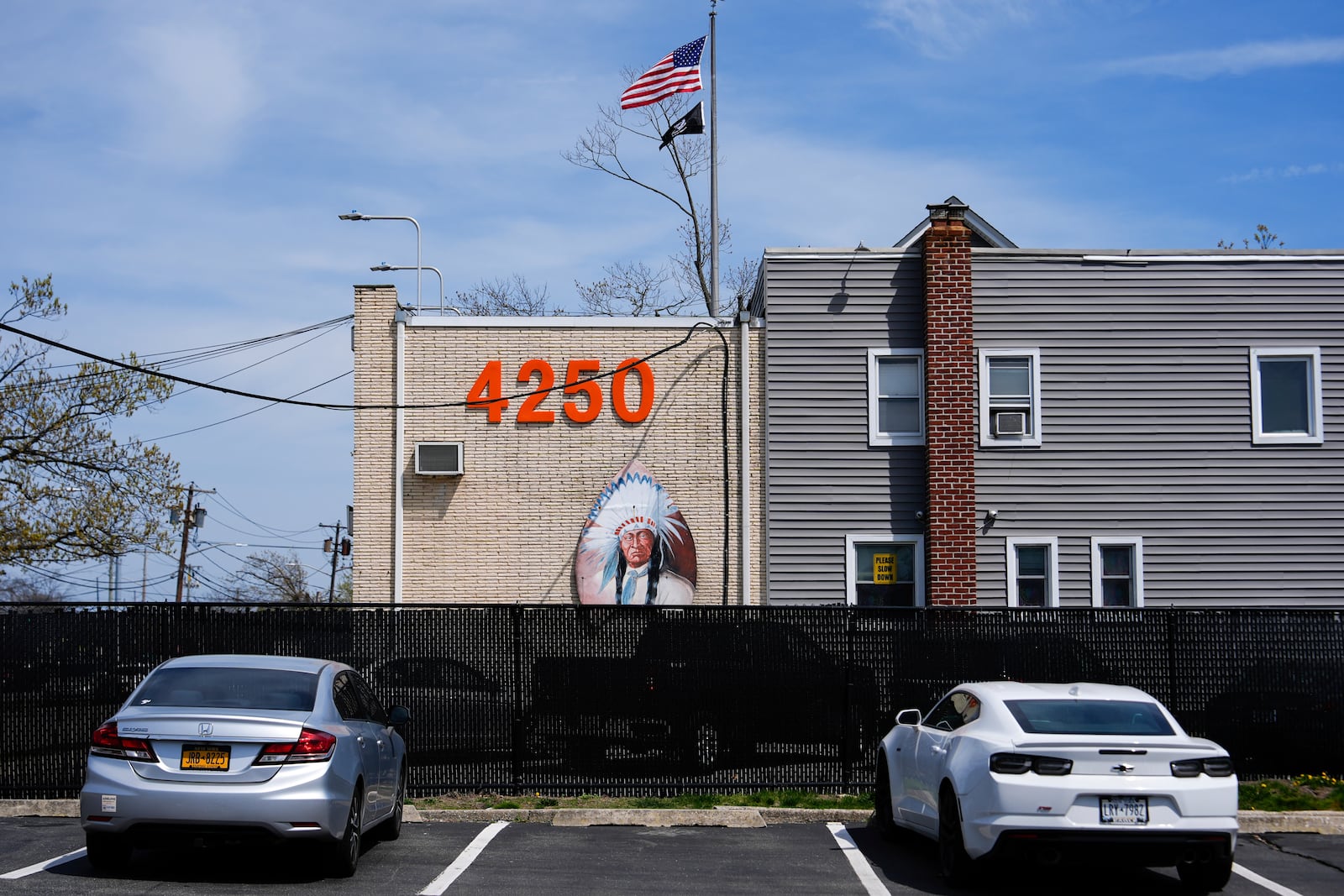 An image of an Indian adorns the facade of the Big Chief Lewis Building, in Massapequa, N.Y., Friday, April 25, 2025. (AP Photo/Julia Demaree Nikhinson)