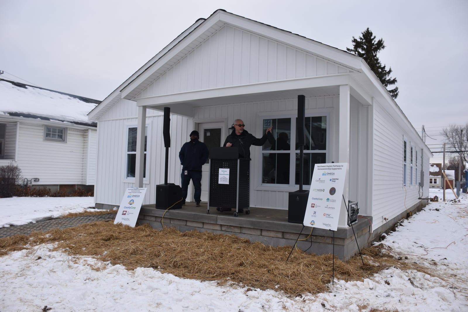 Steve Naas, president of County Corp, talks about two new homes that are under construction on the 700 block of McCleary Avenue in Dayton's Fairview neighborhood at a community event on Dec. 16, 2025. County Corp is developing 30 new homes in northwest Dayton, in partnership with Omega CDC and other community partners. CORNELIUS FROLIK / STAFF
