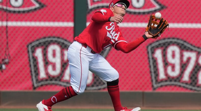 Cincinnati Reds left fielder Austin Hays catches a fly ball hit by San Diego Padres' Gavin Sheets during the first inning of a spring training baseball game, Saturday, March, 1, 2025, in Goodyear, Ariz. (AP Photo/Carolyn Kaster)
