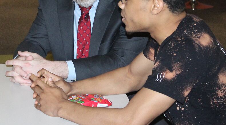 State Superintendent of Public Instruction Paolo DeMaria (left), shown in Springfield, said new report cards released Thursday show improvement across the state. JEFF GUERINI/STAFF