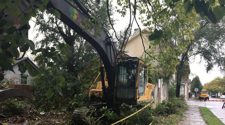 Construction equipment sits behind what will be the 300th home demolished by the Montgomery County Land Bank under the current funding program. CORNELIUS FROLIK / Staff