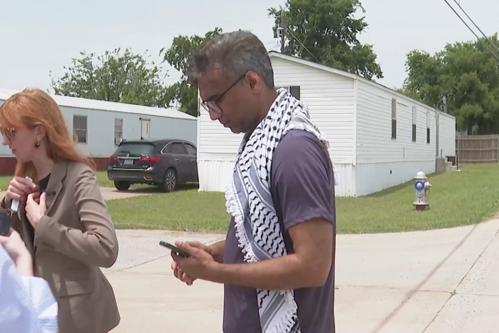 Badar Khan Suri, a Georgetown University scholar from India, walks off after speaking to the media after he was released from immigration detention facility Wednesday, May 14, 2025, in Alvarado, Texas. (AP Photo/Kendria LaFleur)