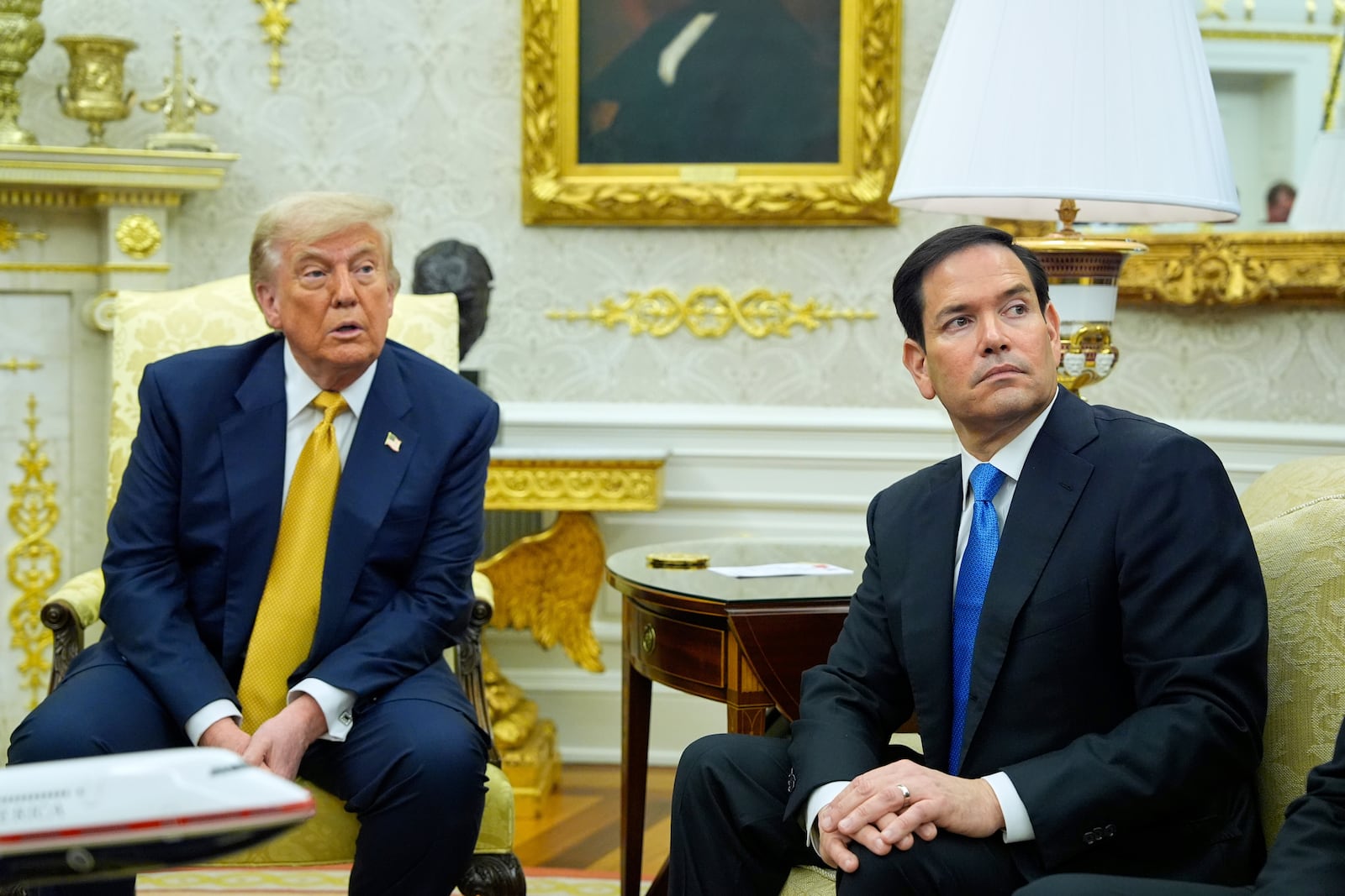 President Donald Trump and Secretary of State Marco Rubio listen during a meeting with Bahrain's Crown Prince Salman bin Hamad Al Khalifa in the Oval Office of the White House, Wednesday, July 16, 2025, in Washington. (AP Photo/Alex Brandon)