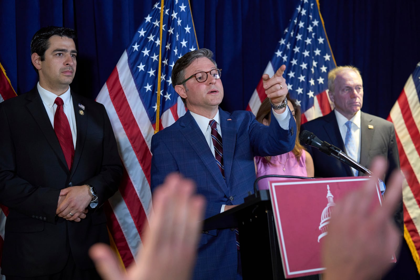 Speaker of the House Mike Johnson, R-La., center, flanked by Rep. Gabe Evans, R-Colo., left, and House Majority Leader Steve Scalise, R-La., defends Donald Trump's handling of protests in Los Angeles and echoed the president's attacks on Democratic Gov. Gavin Newsom as Trump sends thousands of National Guard troops and 700 active duty Marines to quell the protests over raids by Immigration and Customs Enforcement, during a news conference at the RNC near the Capitol in Washington, Tuesday, June 10, 2025. (AP Photo/J. Scott Applewhite)