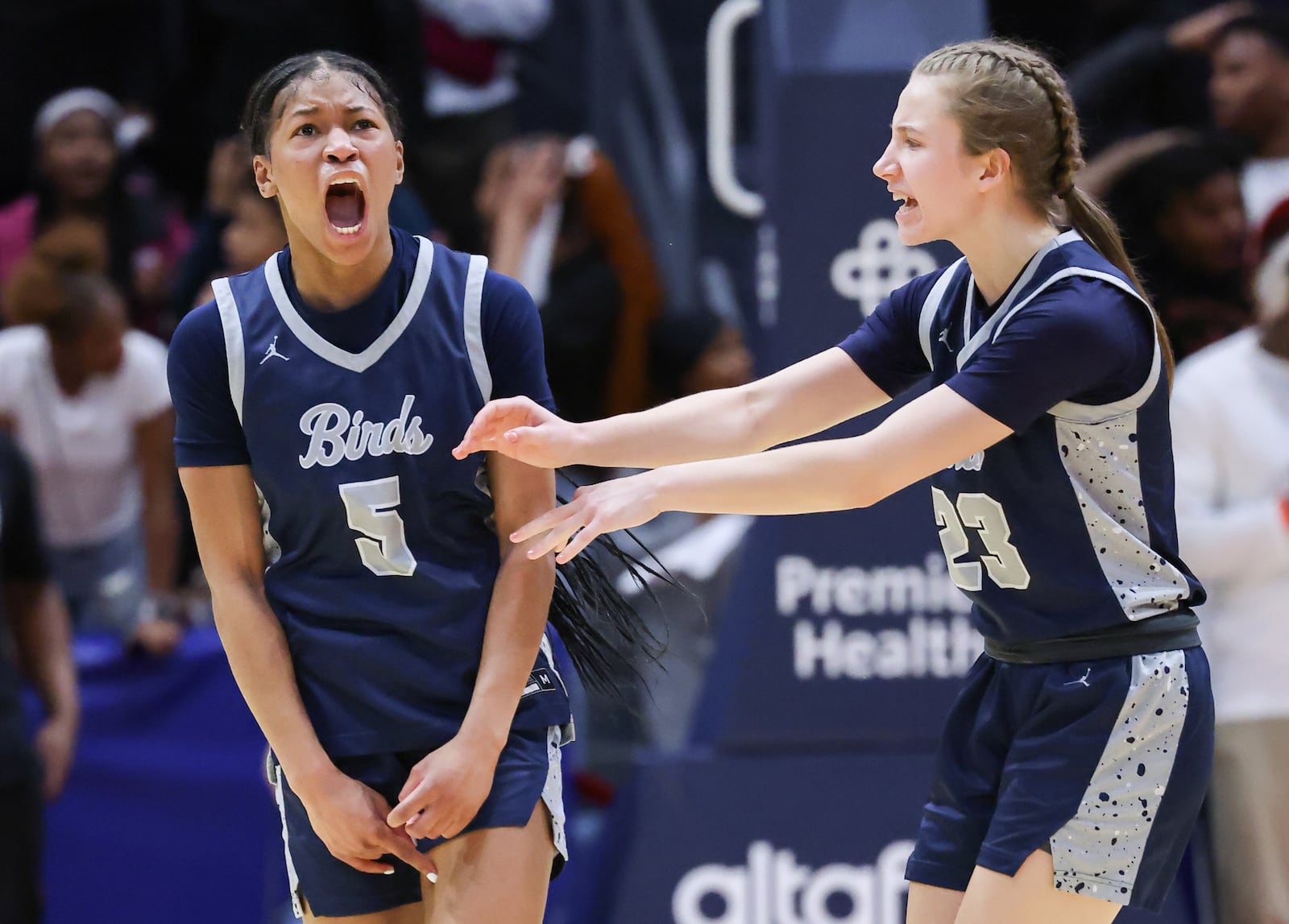 Fairont senior guard Kaylah Thorton (left) celebrates with junior guard Peyton Adams after hitting a tying 3-pointer to send the Division I state final to overtime on Saturday at University of Dayton Arena. The Firebirds won 61-55 to capture their first state title since 2013. BRYANT BILLING / STAFF