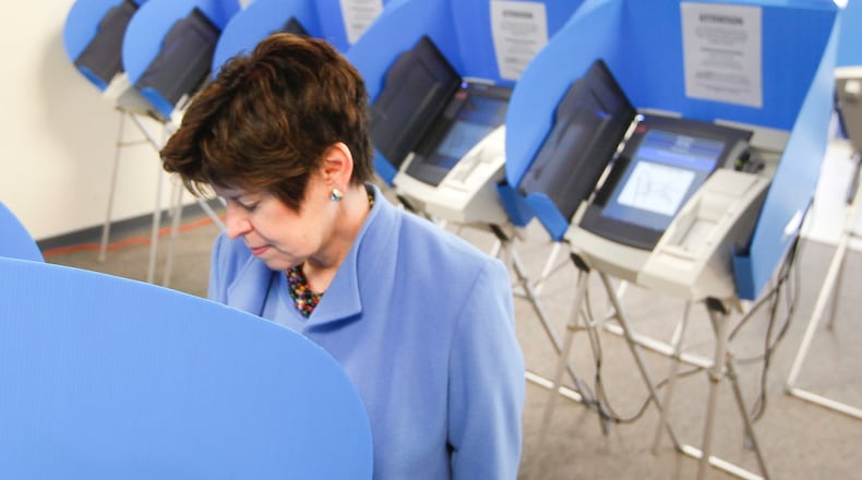 Sharen Neuhardt, the Yellow Springs resident and running mate of Democratic gubernatorial candidate Ed FitzGerald, casts her ballot at the Greene County Board of Elections in Xenia on the state’s first day of early voting for the May 6 primary. CHRIS STEWART / STAFF