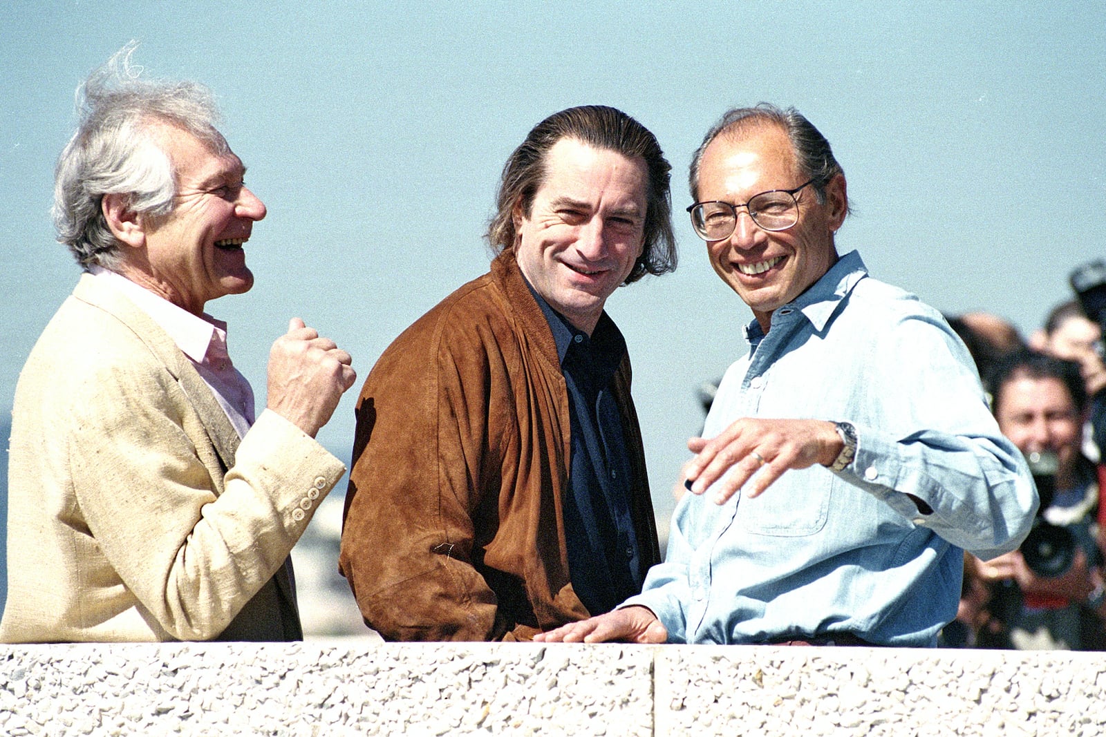 FILE - Actor Robert De Niro, center, appears with fellow actor Sam Wanamaker, left, and director Irwin Winkler, during the 44th Cannes Film Festival in Southern France, where they will present their motion picture "Guilty by Suspicion," on May 17, 1991. (AP Photo/Gilbert Tourte, Film)
