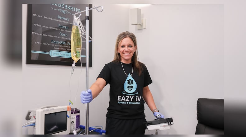 Brittany Kafka poses with equipment in Eazy iV Hydration and Wellness Clinic in Centerville Tuesday, Sept. 16, 2025. Kafka said the clinic offers hydration therapies and infusions of vitamins and other substances that support health. BRYANT BILLING/STAFF