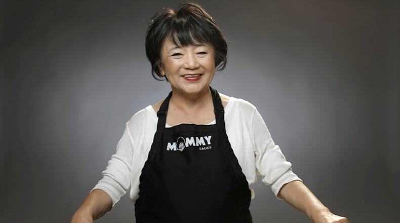 Jai Nam "Mommy Choi" Choi, makes a traditional spicy Korean rice cake dish -- dduk-bok-gi -- usually made during the holidays. (Myung J. Chun/Los Angeles Times/TNS)