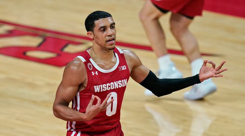 Wisconsin's D'Mitrik Trice reacts after sinking a 3-point basket during the second half of the team's NCAA college basketball game against Rutgers, Friday, Jan. 15, 2021, in Piscataway, N.J. Wisconsin won 60-54. (AP Photo/Seth Wenig)