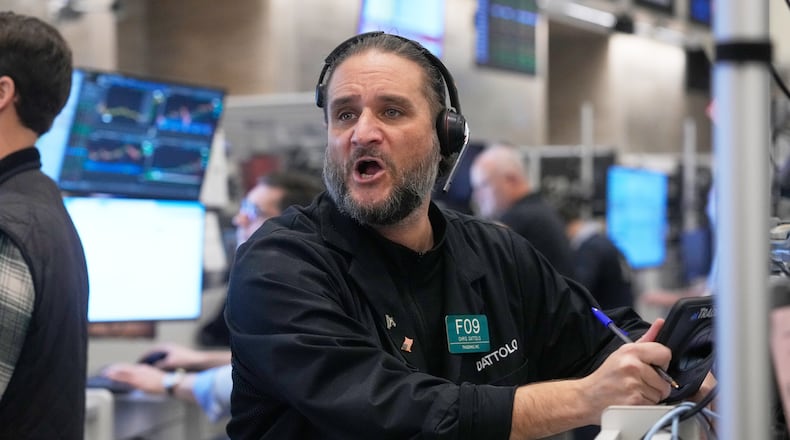 Options trader Chris Dattolo works on the floor of the New York Stock Exchange, Wednesday, Nov. 12, 2025. (AP Photo/Richard Drew)