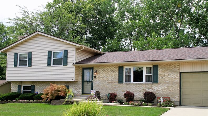 The quad-level home has a semi-finished basement, a lower-level family room, potentially 4 bedrooms and 3 full bathrooms. There is an attached, 2-car garage. CONTRIBUTED PHOTOS BY KATHY TYLER