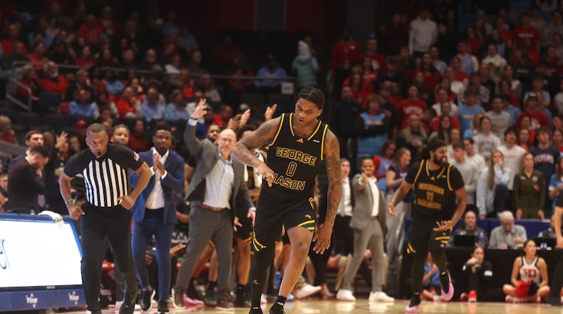 George Mason's K.D. Johnson celebrates after making a 3-pointer against Dayton in the second half on Wednesday, Jan. 15, 2025, at UD Arena. David Jablonski/Staff